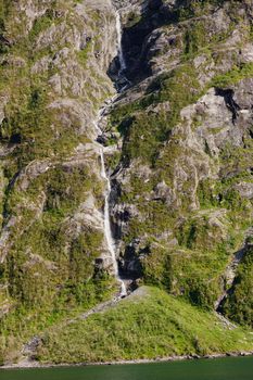 Beautiful and imposing Norwegian fjord in spring with its waterfalls.