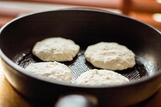 Pancakes on frying pan, rustic cookbook recipe - weekend cooking, food blog and homemade cuisine concept. Making your favorite pancakes