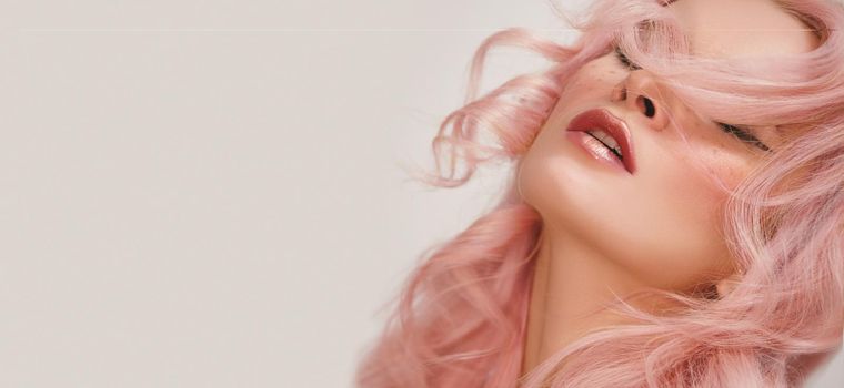 Soft-Girl Style with Pink Flying Hair, Fashion Makeup. Woman Face with Fake Freckles and Rose Hairstyle. Blonde Female Model with Fresh Skin, Blush Rouge. Valentines Day Look or Freshness Spring Style
