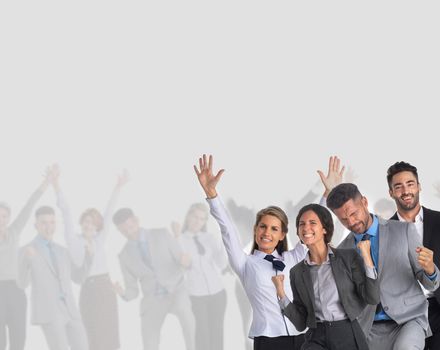 Very happy business group with arms raised over gray background with copy space for text