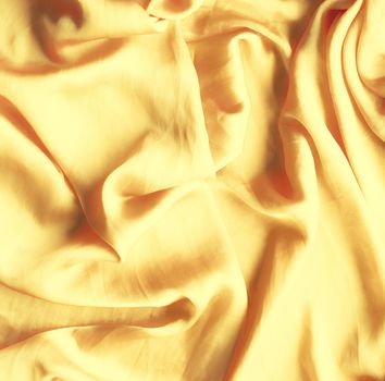 Luxury golden silk - elegant fabric textures, abstract backgrounds and modern pastel colours concept