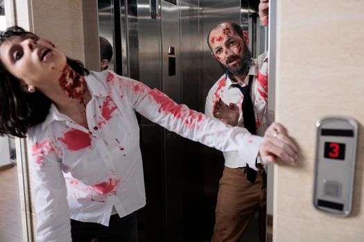 Portrait of zombies leaving office elevator, escaping to chase after people and looking scary terrifying. Brain eating corpses with scars attacking workplace, horrific aggressive walking dead.