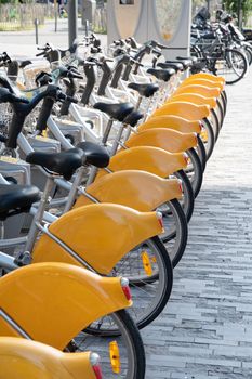 public yellow bicycles parked in the sharing on the street BRUSSELS, BELGIUM High quality photo