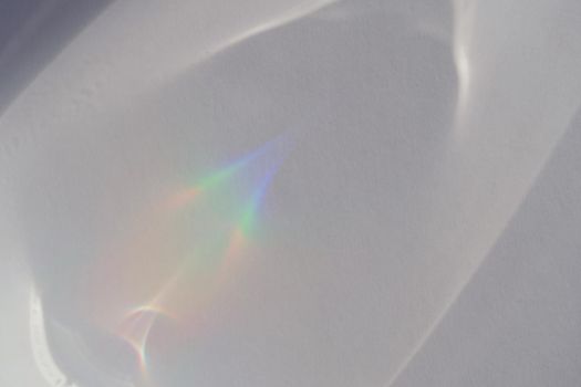 Abstract natural light refraction silhouette on water surface mock up.Caustic effect light refraction on white wall overlay photo mockup, blurred sun rays refracting through glass prism with shadow