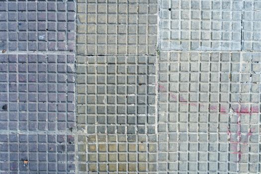 A Background of square tiles or slabs on a wall.