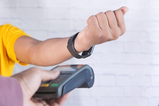 Payment terminal charging from a smart watch , contactless payment