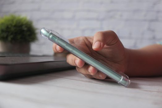 close up of women hand holding smart phone.