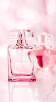 Perfume bottles on glamour background, floral feminine scent, fragrance and eau de parfum as luxury holiday gift, cosmetic and beauty brand present concept