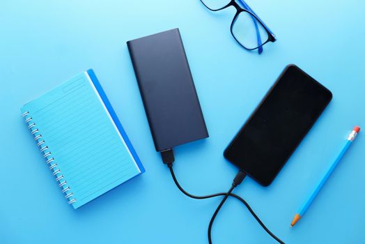 smart phone charging with Power bank top view.