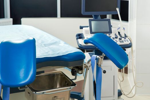 Empty Gynecological room with chair and equipment