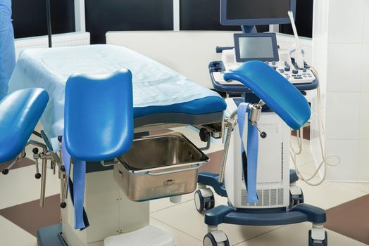Empty Gynecological room with chair and equipment