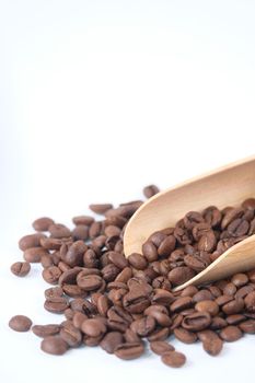 top view of fresh coffee beans on white background with copy space