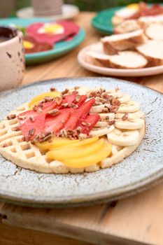 delicious waffle on wooden table. delicious breakfast waffle.