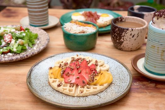 delicious waffle on wooden table. delicious breakfast waffle.