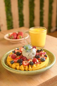 delicious waffle on wooden table. delicious breakfast waffle.