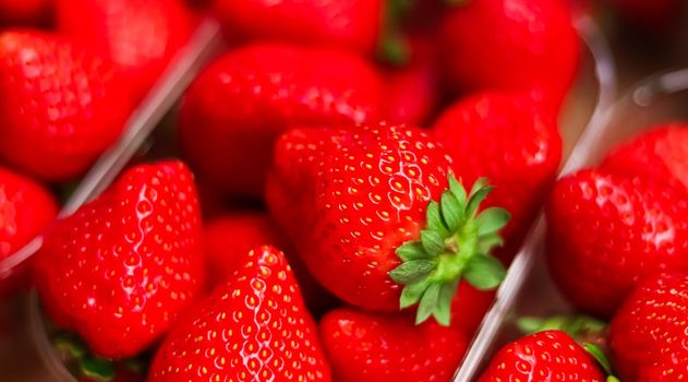 Strawberries packaged in box, sweet ripe perfect strawberry harvest, organic garden and agriculture concept