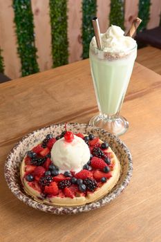 delicious waffle on wooden table. delicious breakfast waffle.