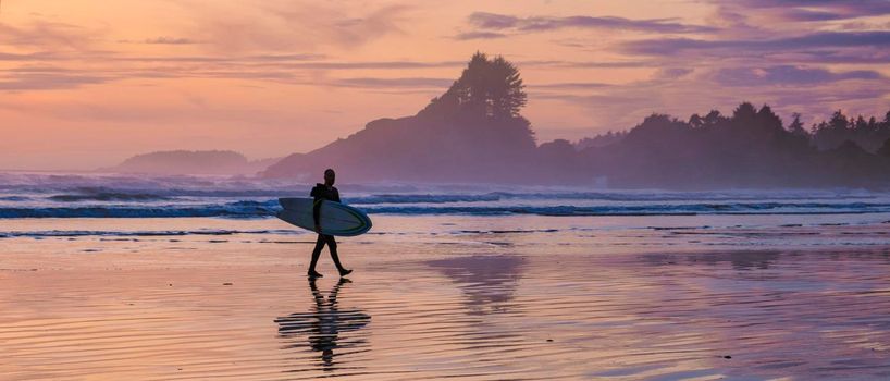 Tofino Vancouver Island Pacific rim coast, surfers with surfboard during sunset at the beach, surfers silhouette Canada Vancouver Island Tofino Vancouver Islander Island