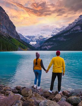 Lake Louise Canadian Rockies Banff national park, Beautiful autumn views Lake Louise in Banff National Park in the Rocky Mountains of Alberta Canada. young couple men and women visiting Lake Louise