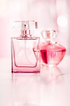 Perfume bottles on glamour background, floral feminine scent, fragrance and eau de parfum as luxury holiday gift, cosmetic and beauty brand present concept