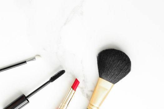 Make-up and cosmetics on marble, flatlay - modern feminine lifestyle, vlog background and styled stock concept. Beauty inspiration in a fashion blog