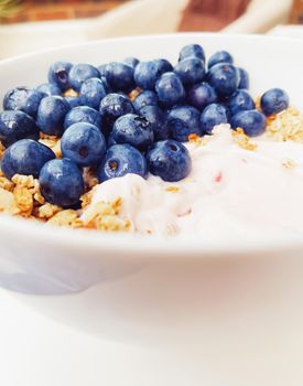 Blueberry yogurt cereal bowl as healthy breakfast and morning meal, sweet food and organic berry fruit, diet and nutrition concept