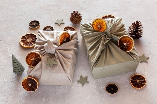 Christmas gifts textile packed, decorated with natural materials, zero waste concept
