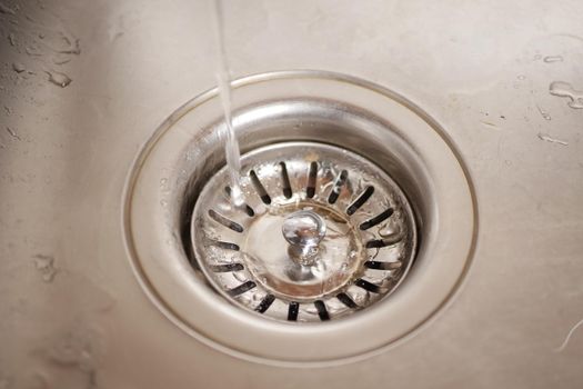 Faucet with flowing water closeup