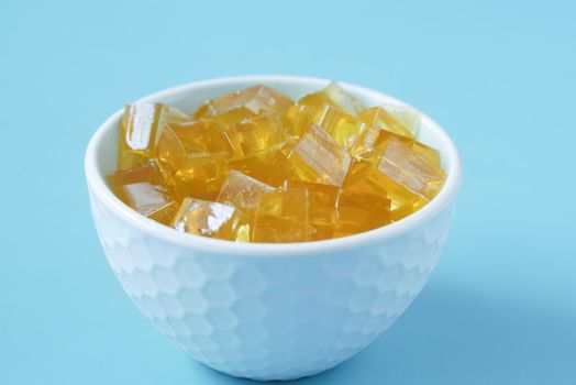 close up of colorful jelly on plate on table,.