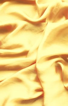 Luxury golden silk background texture - elegant fabric textures, abstract backgrounds and modern pastel colours concept