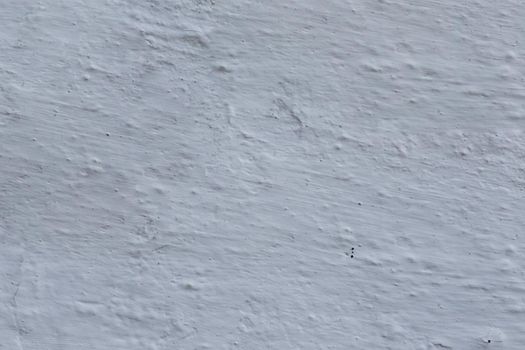 Texture of old uneven gray plaster.