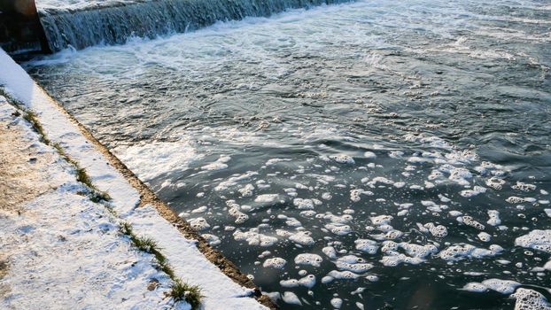 Water flowing quickly through a rapid cascade of River.