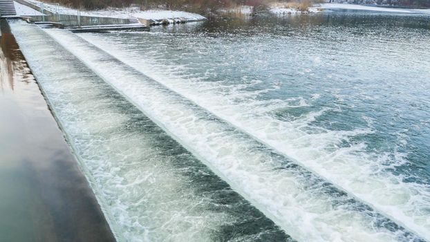 Cascade waterfall river. View of the river dam in spring.