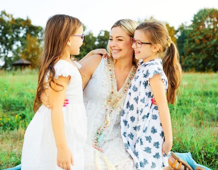 Portrait of a young happy family having fun outdoors