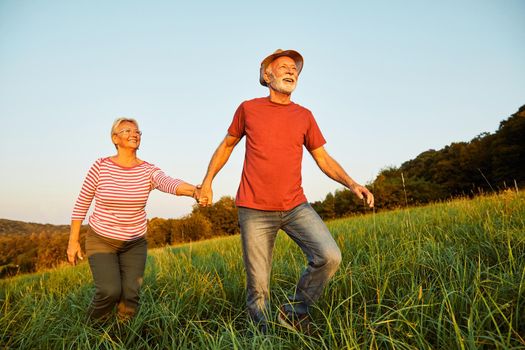 Happy active senior couple outdoors