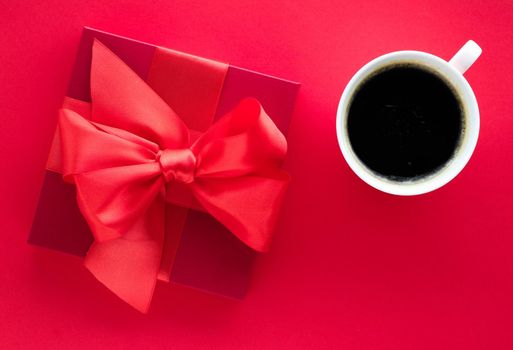 Romantic celebration, lifestyle and birthday present concept - Luxury beauty gift box and coffee on red, flatlay