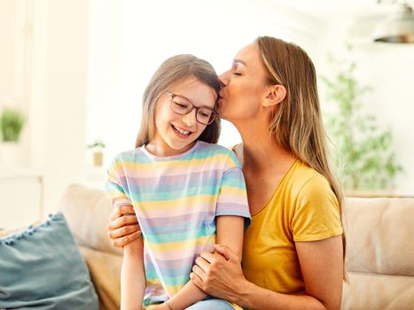 mother and daughter playing and having fun at home