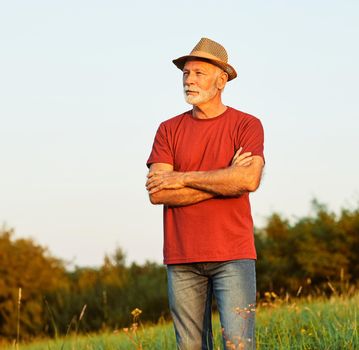 Portrait of a senior elderly man posing outdoors