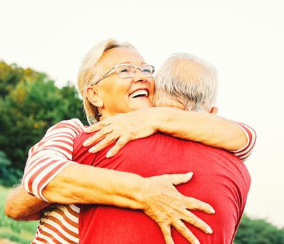 Happy active senior couple outdoors