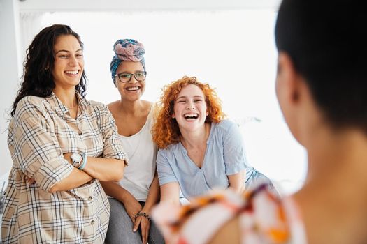 Portrait of a group of young happy women indoors or in start up office