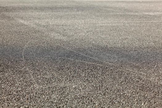 Detail of asphalt road from low angle. Abstract urban background.