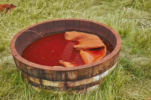dyeing leather in a barrel in the ancient way