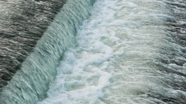 A close-up view of the river dam. Cascade waterfall river.