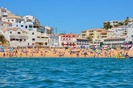 PORTIMAO, PORTUGAL - AUGUST 02, 2017: Overcrowded beach in the south of the Portuguese region of the Algarve
