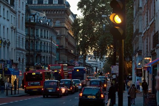 London, United Kingdom - November 18th, 2006: Typical afternoon traffic in UK capital, heavy but not hold up. Mostly taxis and buses driving, cars must pay congestion charge to drive in central zone.