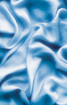 Blue soft silk waves, flatlay - elegant fabric textures, abstract backgrounds and modern pastel colours concept. Feel the touch of luxury