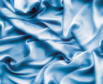 Blue soft silk waves, flatlay - elegant fabric textures, abstract backgrounds and modern pastel colours concept. Feel the touch of luxury