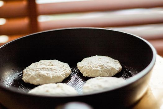 Pancakes on frying pan, rustic cookbook recipe - weekend cooking, food blog and homemade cuisine concept. Making your favorite pancakes