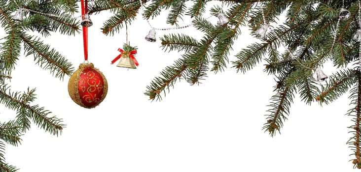 Branches of fir tree with ball, bells and other Christmas ornament on white isolated background