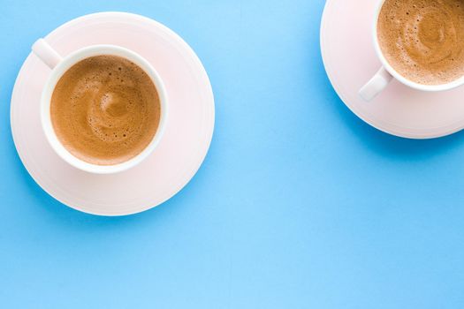 Breakfast, drinks and modern lifestyle concept - Hot aromatic coffee on blue background, flatlay